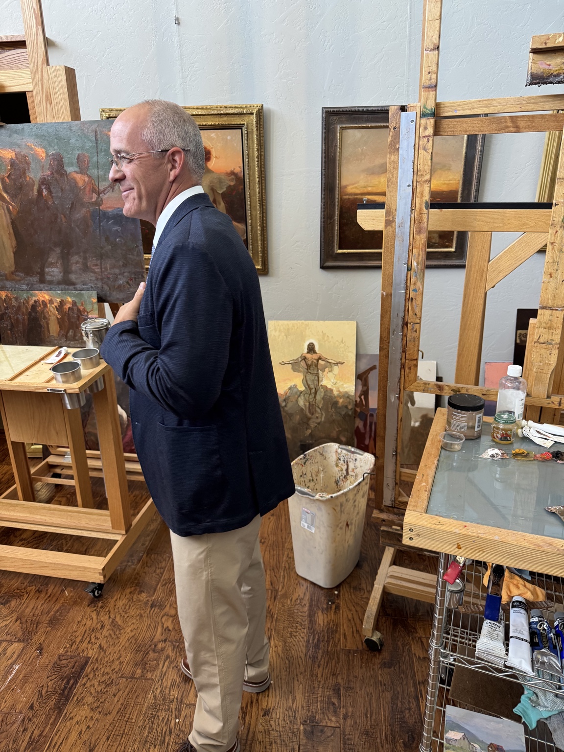 Michael Malm discussing artwork in his studio